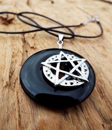 The Fascinating History of Witch Symbol Necklaces as Talismans of Protection
